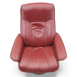 Ekornes - 'Stressless' maroon leather reclining swivel armchair, with high padded back and panel-stitched upholstery, shaped armrests, on a circular laminated wood swivel base
