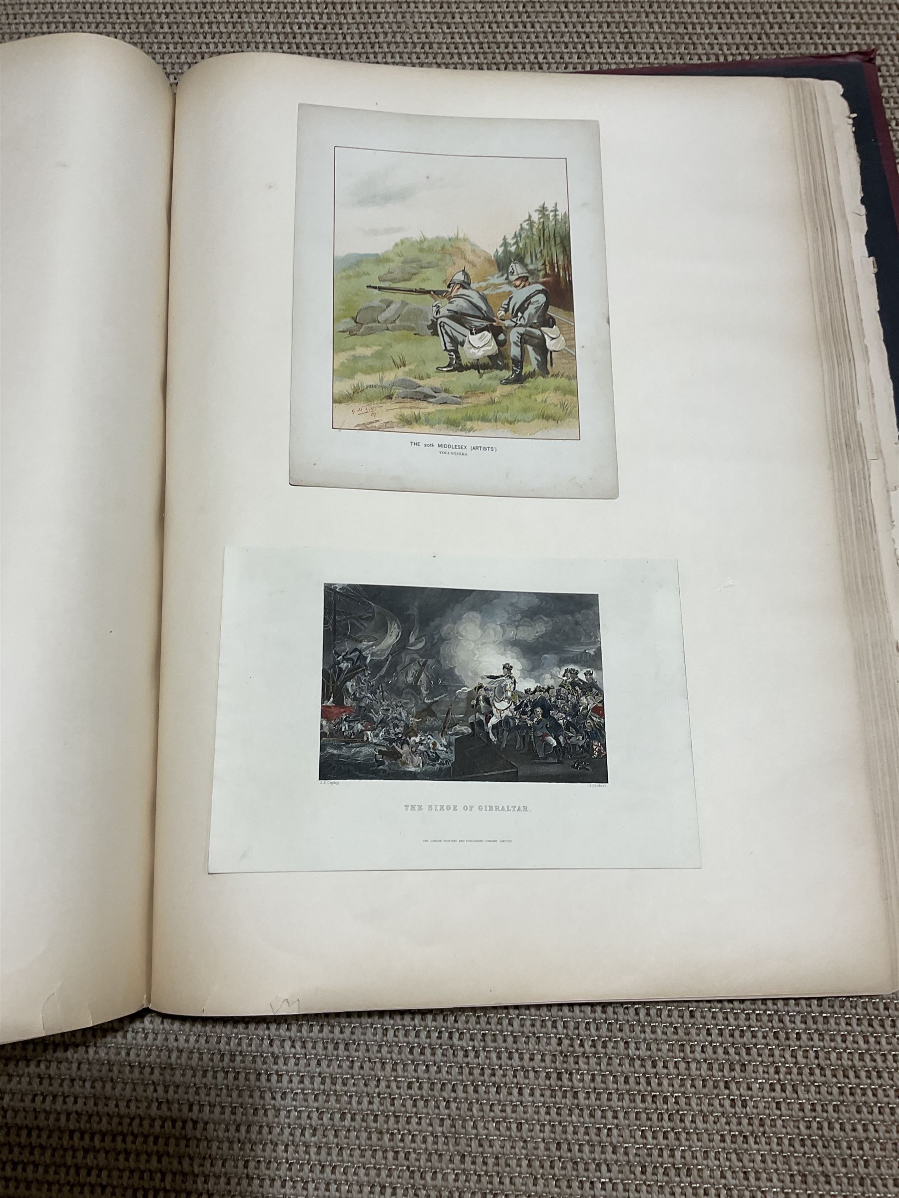 Large album of 19th century and later engravings and prints, mostly military, stuck down, album 49cm x 62cm overall
