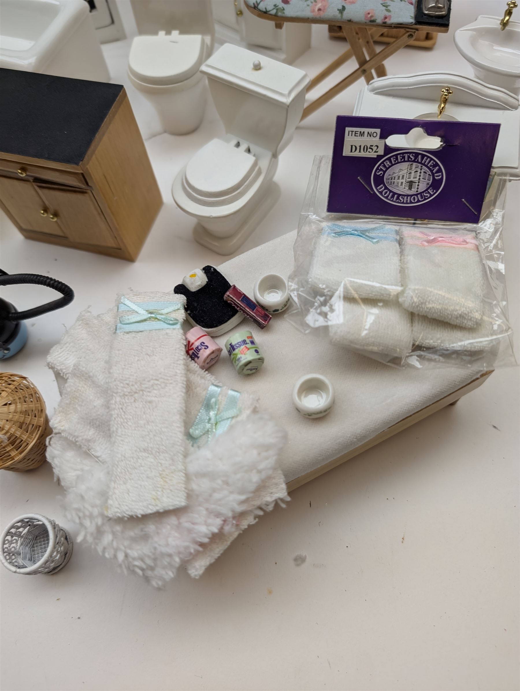 Modern 1:12 scale dolls house furniture, comprising pine kitchen set, with wall cabinets, floor cabinets and sink unit, white wooden bathroom suite, white wooden kitchen and dining room furniture and appliances, wooden bedroom furniture, Raine purple wingback chair, tv, desk, fish tank, etc