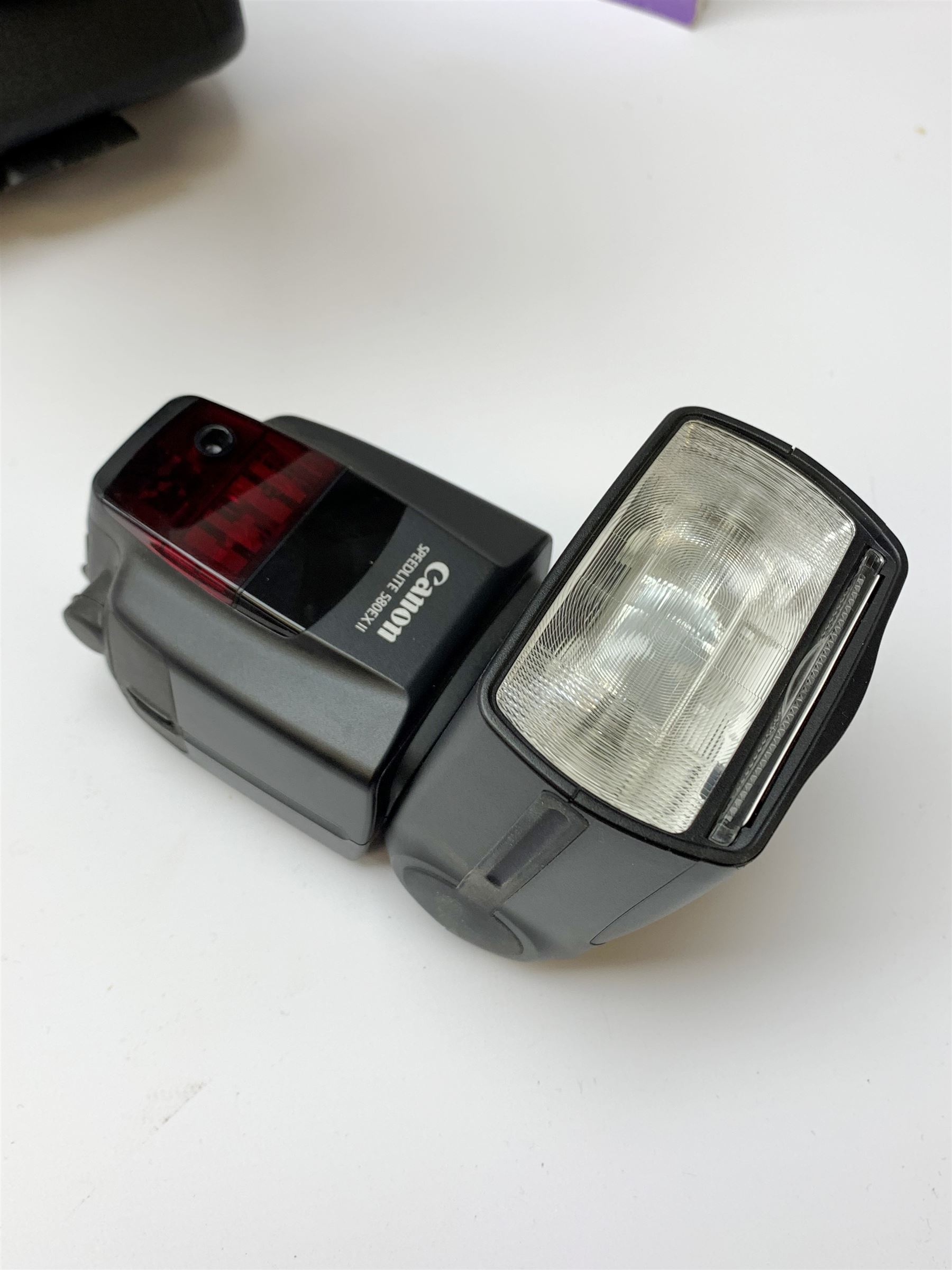 Canon EOS 5D camera body with Canon 'BG-E6' battery grip, Canon 'Speedlite 580EXII' flash and Canon lens 'Canon Zoom Lens EF 24-105mm 1:4 L IS USM' with Canon EOS 5D Mark II instruction manual