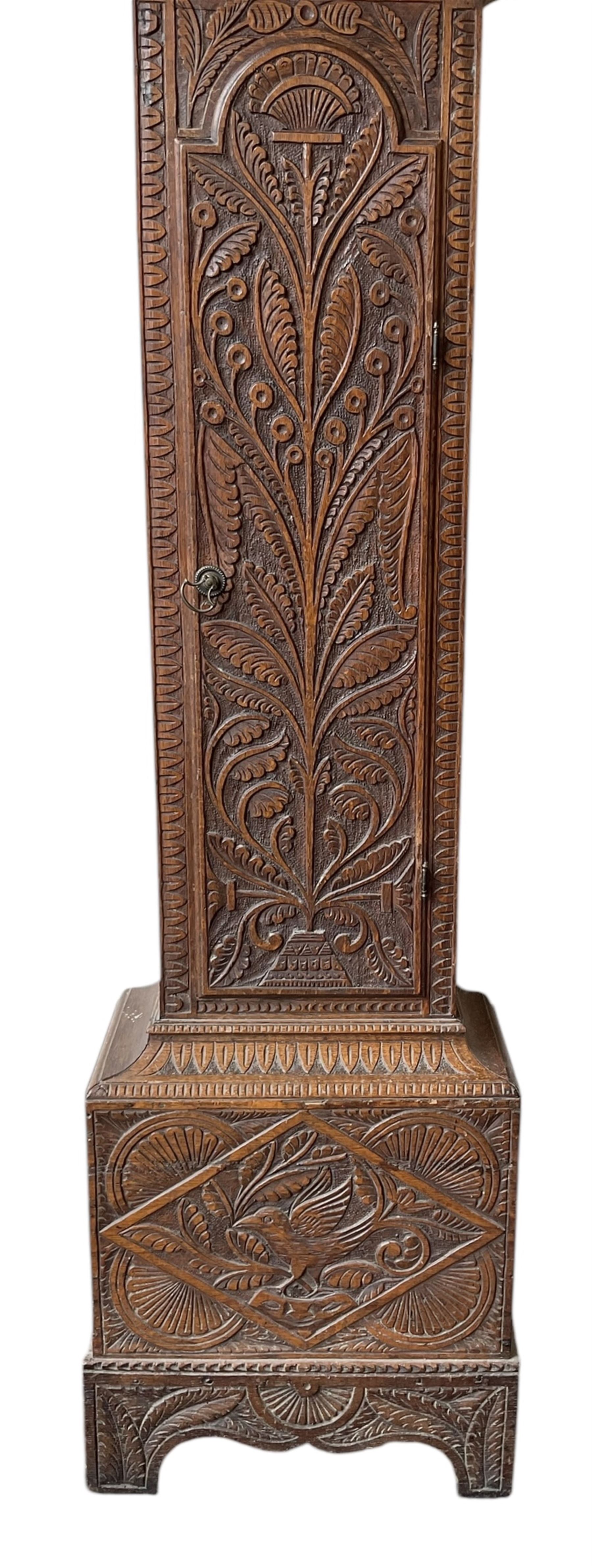 Robert Henderson of Scarborough -mid-18th century eight-day longcase clock c1750, with a flat topped pediment and broad cornice, carved frieze beneath and a square hood door flanked by detached pilasters with gesso capitals, profusely carved trunk with a break arch topped door on a square plinth raised on a shaped base, brass dial with a matted and engraved dial centre, cast spandrels and chapter with Roman numerals and five minute Arabic's, with a seconds dial and date aperture, dial pined directly to a rack striking movement with a recoil anchor escapement, sounding the hours on a bell. With weights and pendulum.
Robert Henderson was one of the first clockmaker recorded as working in Scarborough, b1678-d1756.

