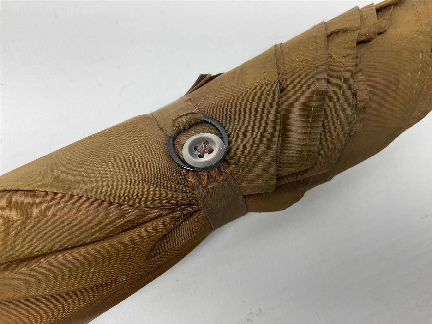Edwardian novelty parasol by Briggs of London, the bamboo shaft with brown fabric canopy, and silver mounted terminal concealing a silver mounted pencil, hallmarked Charles Henry Dumenil, London 1904, also marked Briggs, H93cm