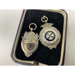 Four St John's silver fobs, together with two silver Directors Ambulance shield fobs and two other St Johns items 