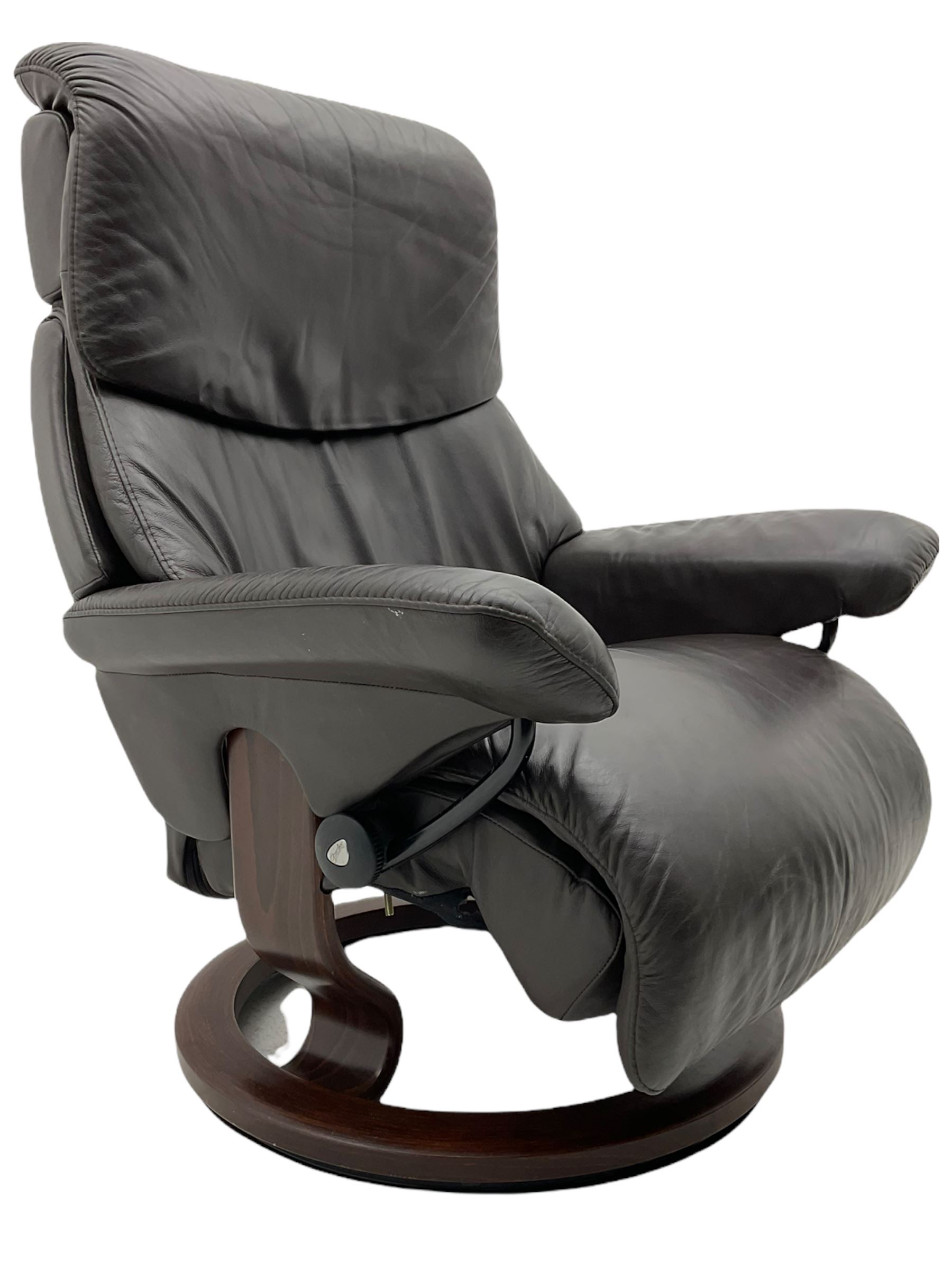 Ekornes Stressless - swivel reclining armchair with adjustable headrest, upholstered in cocoa brown leather, with matching footstool