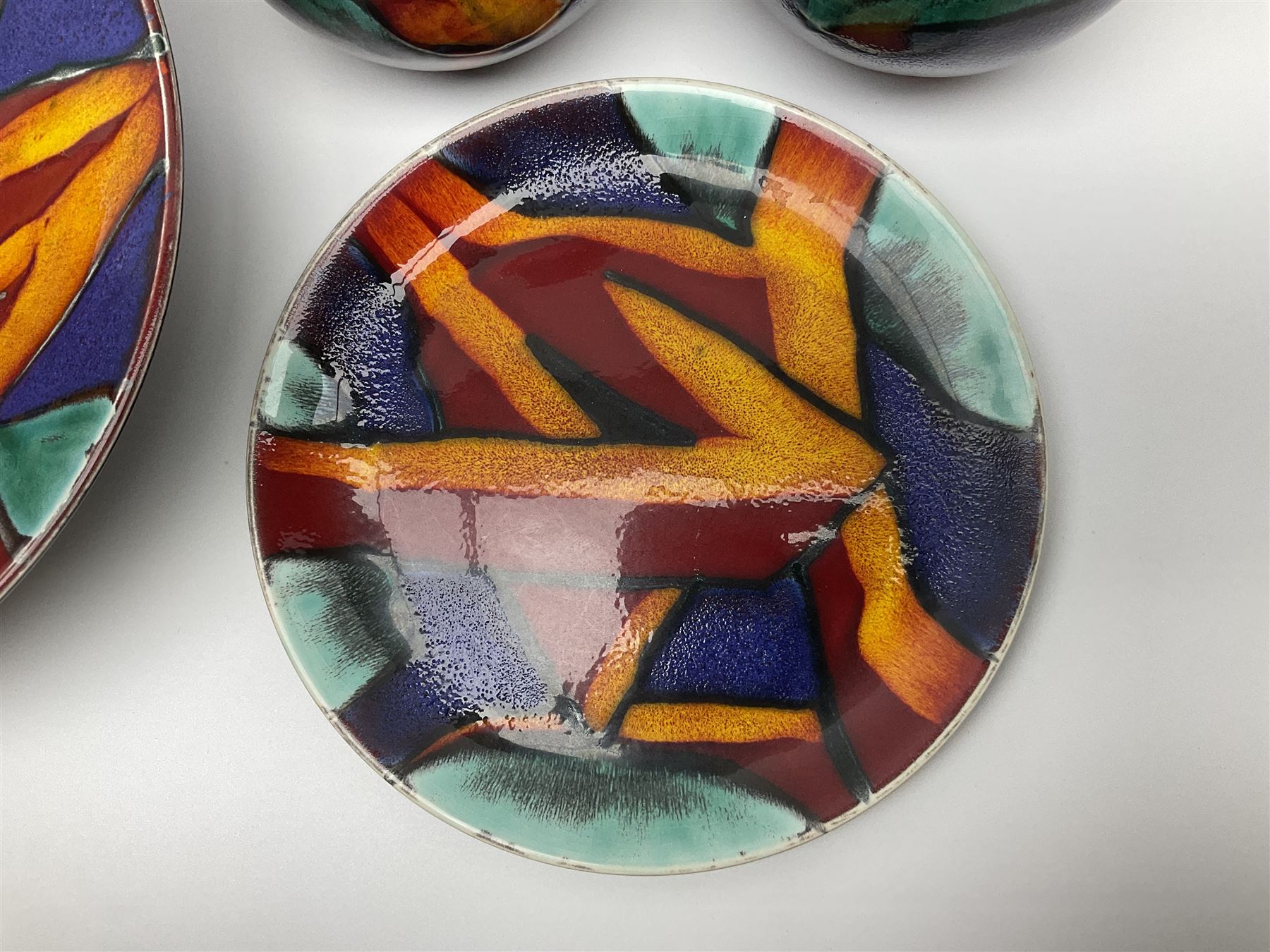 Four pieces of Poole Pottery in Graffiti pattern, comprising pair of vases of baluster form, dish and small plate, with impressed or printed marks beneath, vase H17cm