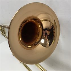 Sebastian Bucklet Aquae Sulis copper and brass trombone No.0910004; in lightweight carrying case; and Kinsman folding tubular chrome music stand in case (2)