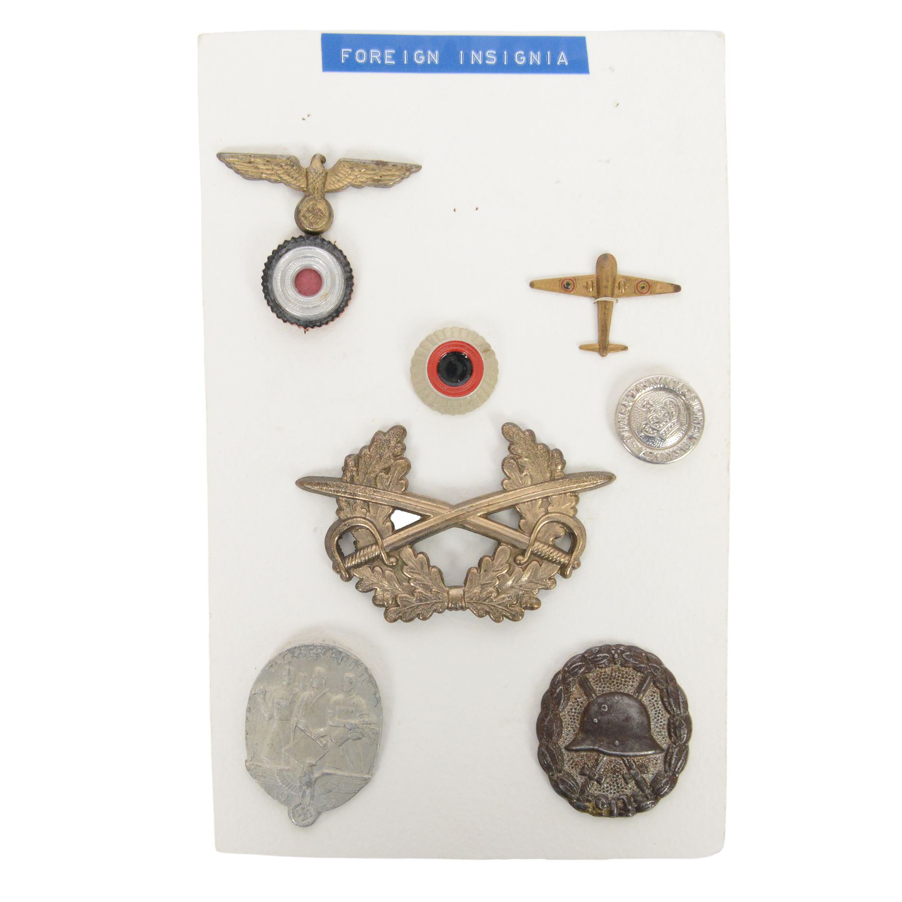 WWII German badges, including Wound Badge, Kriegsmarine cap insignia, Labour Day badge and others 