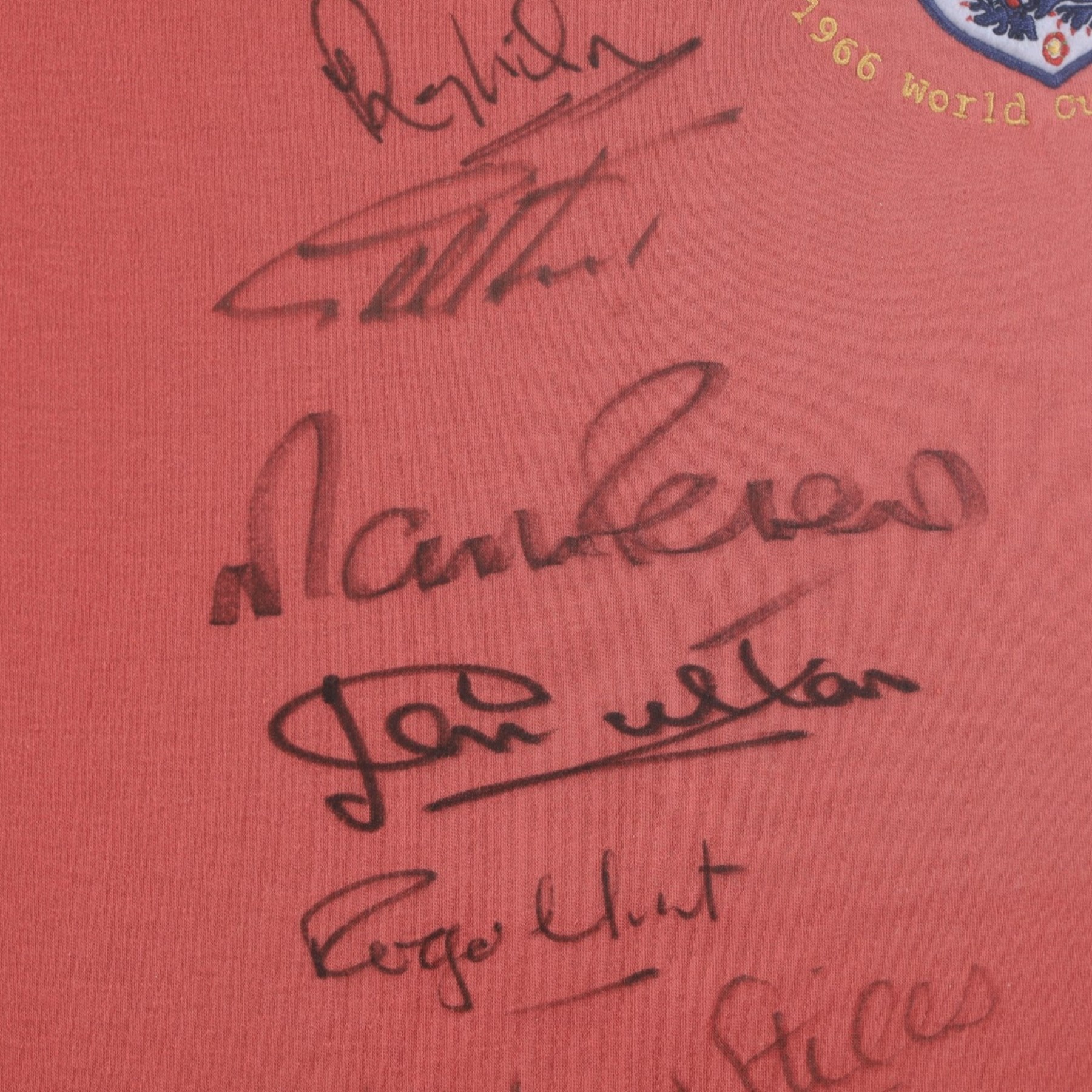Signed 40th anniversary 1966 England World Cup shirt, signed by Gordon Banks, George Cohen, Ray Wilson, Jack Charlton, Alan Ball, Nobby Stiles, Roger Hunt, Martin Peters and Geoff Hurst, framed with certificate of authenticity from Richard Hill verso, frame H91cm