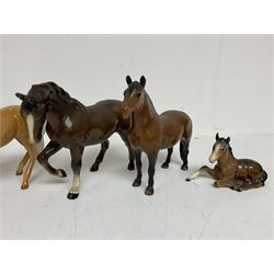 Group of Beswick figures of horses, to include a Palomino horse, Bay Shire horse, recumbent bay foal etc, all with printed marks beneath (5)