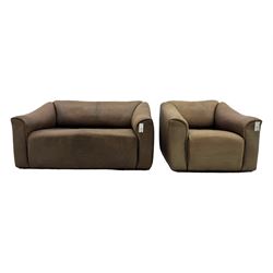Mid-20th century two seater sofa, upholstered in soft brown leather with visible patina, curved arms and low back, on concealed supports (W138cm, D86cm, H72cm); matching armchair (W84cm, D86cm, H72cm)