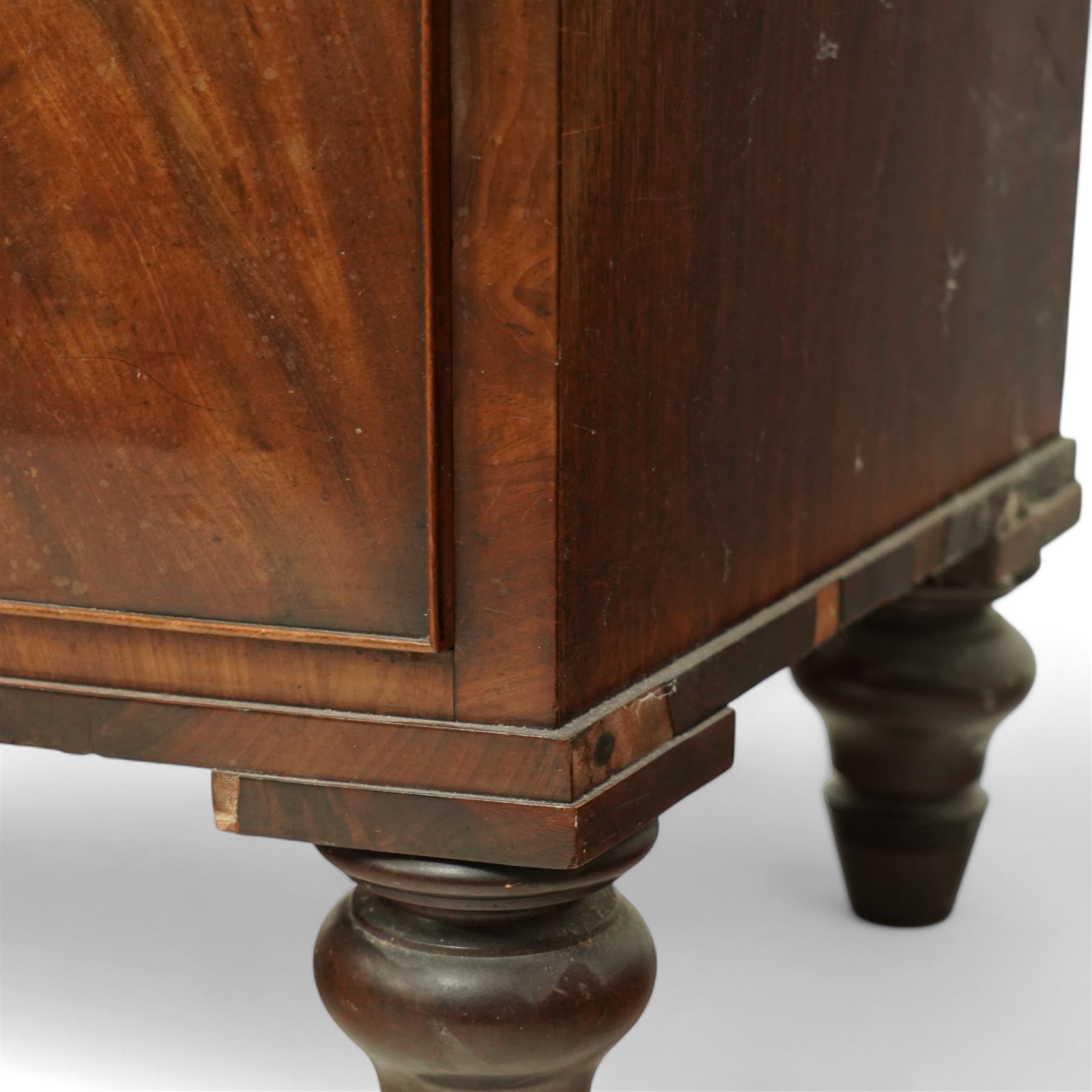 19th century mahogany chest of drawers, bow fronted form with two short over three long drawers, each veneered in matched flame mahogany, on turned feet