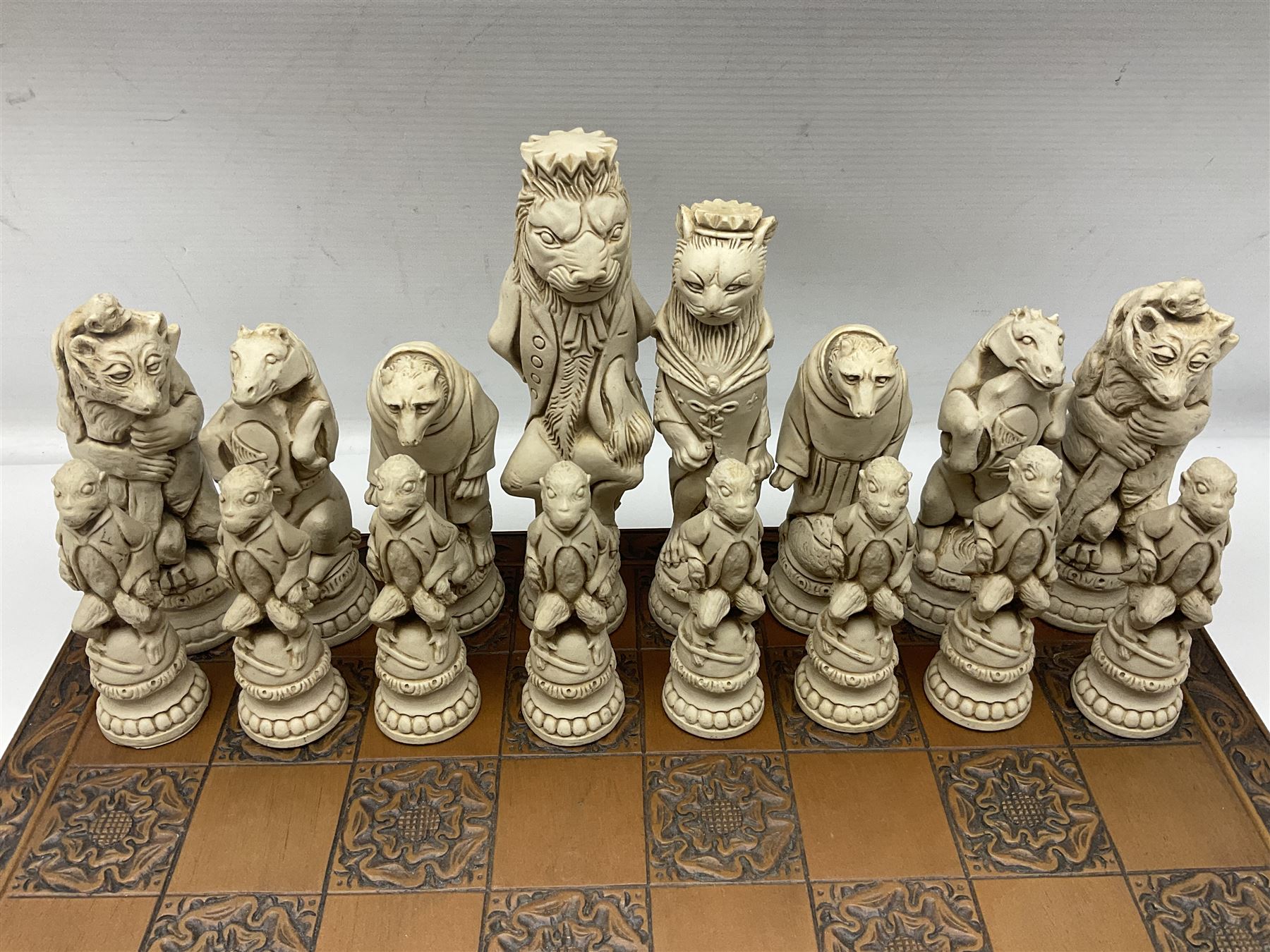 Chess set and resin chess pieces moulded as various animals, the pawns as monkeys, Kings as lions etc, board L46cm, W46cm, king H19cm