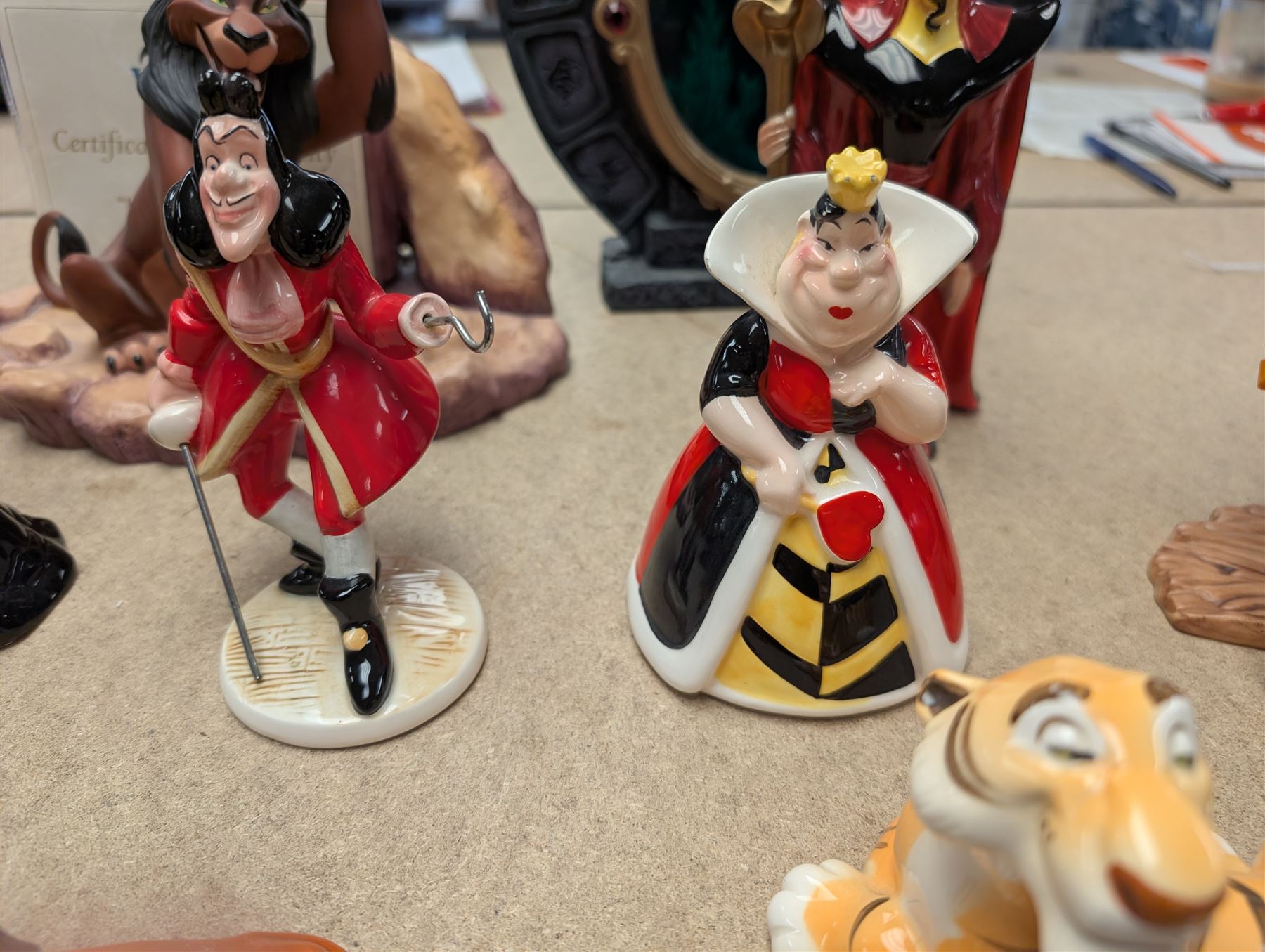 Collection of Disney figurines, comprising Disney Villains 'Life's Not Fair, is it?', with certificate of authenticity, Snow White Magic Mirror and seven ceramic figures including Jafar, Queen of Hearts and Scar
