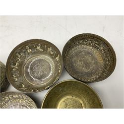Beaten copper tray with repeat pattern and fluted rim, together with six brass cups, tray L41cm 