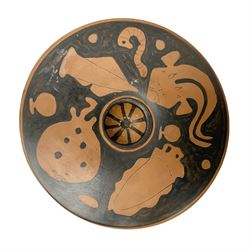 Ancient Greek style red figure fish plate, with striped central recess surrounded by fish and sea creatures, with wave detailed edge, the reverse signed indistinctly, D23.5cm H4.5cm