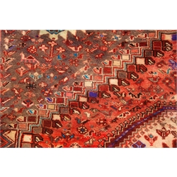  Persian red ground rug, three medallions, floral field, 300cm x 205cm  