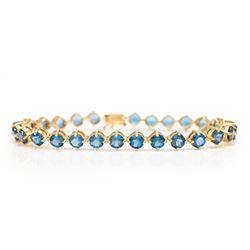 9ct gold London blue topaz bracelet, set with twenty-seven round cut topaz's, Birmingham 2006