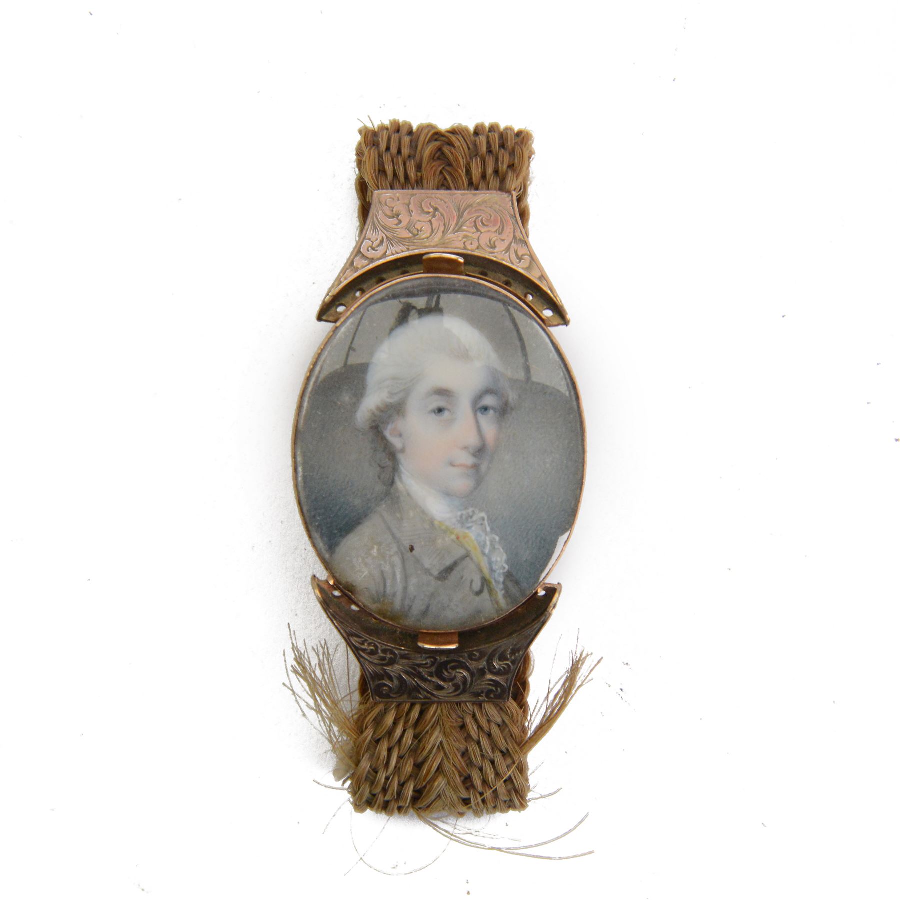 English School (18th century)
Portrait miniature upon ivory
Head and shoulder portrait of Henry Chichester (1724–1799) of Northcote, Devon, and Northover, Somerset, wearing grey coat and white cravat 
Within period gold plated frame, and hairwork strap with foliate engraved gold plated mounts
Oval 3.5cm x 3cm

Provenance: By family descent from the Chichesters of Arlington Court, Devon; from the collection of Andrew Chichester Everitt.

This lot has been registered for sale under Section 10 of the APHA Ivory Act