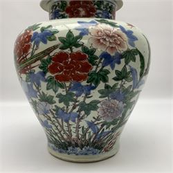 19th century Chinese Wucai vase and cover, decorated  with peacock on blue rockwork and other birds flying amongst tree peonies, H43cm