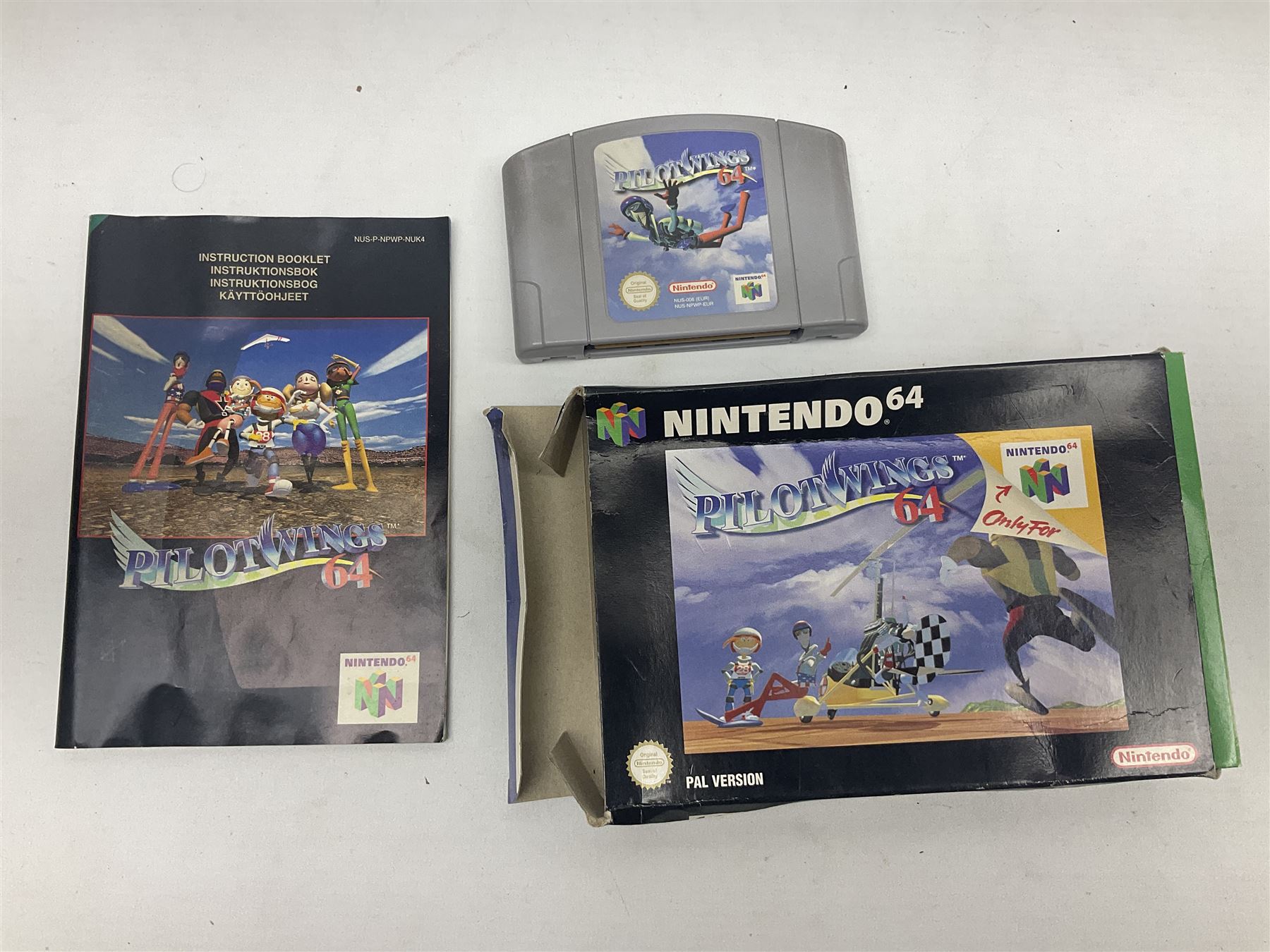 Nintendo 64 console, two controllers, games and accessories. Accessories to include the ‘Tremorpak’ and ‘Spook’ 2 Phono plugs and a S-VHS plug with adapter, both in original boxes. Games to include ‘Golden Eye 007’, ‘Doom 64’, ‘Killer Instinct Gold’, ‘Tetrisphere’, ‘F-1 World Grand Prix’, ‘Pilotwings 64’ and ‘Lylatwars’ with ‘Rumble Pak’, all with original boxes and instruction manuals. ‘Star Wars Episode I Racer’ game cartridge in Shadows of the Empire box. 