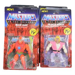 Thirteen Mattel Super7 reissue Masters of The Universe figures, comprising He-Man, Mat-At-Arms, Shadow Weaver, Hordak, Mer-Man, Prince Adam, Trap Jaw, Evil-Lyn, Orko, Skeletor, She-Ra, Beast Man and Teela, all carded
