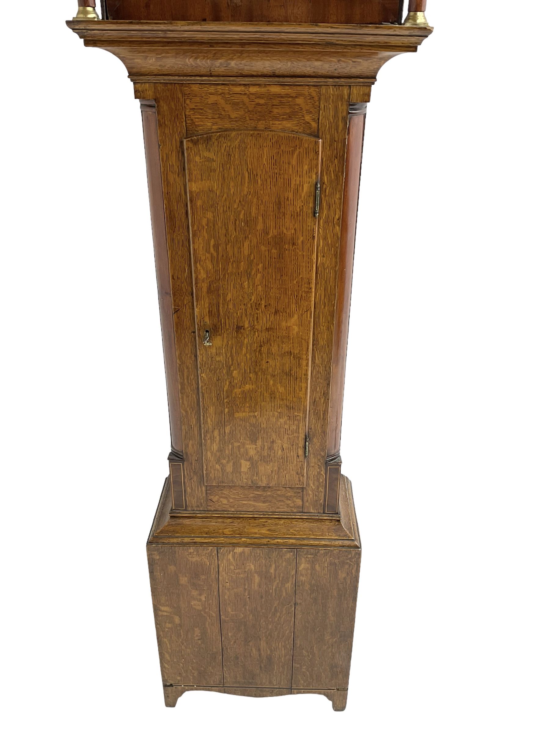 Thomas Gibson of Berwick - oak and mahogany 8-day longcase clock c 1860, with a flat topped pediment and recessed break arch door beneath, free standing pilasters with brass capitals, trunk with quarter columns to the corners and a wavy topped door, on a rectangular oak plinth with a shaped base,  painted dial with floral spandrels and a sporting scene to the break arch, Roman numerals, minute track and subsidiary seconds and date dial's, matching stamped brass hands pinned via a false plate to a rack striking movement, striking the hours on a bell. With weights, pendulum and key.   