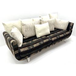Grande four seat sofa upholstered in patterned fabric with contrasting scatter cushions 