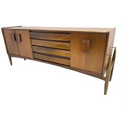 Elliots of Newbury (EoN) - mid-20th century teak sideboard, fitted with four central doors flanked by fall-front cupboard and a double cupboard, each with concave wooden handles