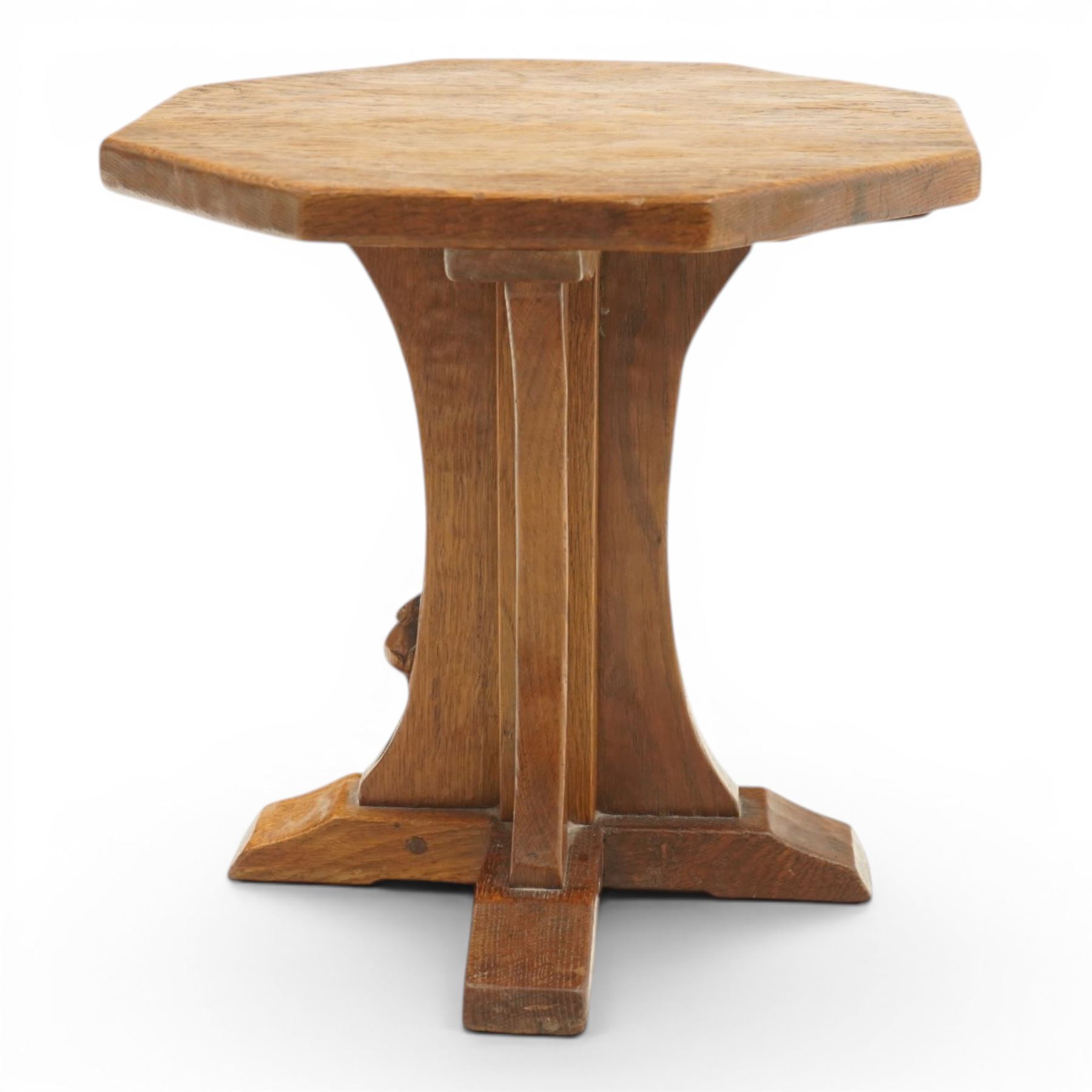 Mouseman - mid-20th century adzed oak coffee table of small proportions, the octagonal  adzed top raised on cruciform base and sledge feet, carved with mouse signature, by the workshop of Robert Thompson of Kilburn 