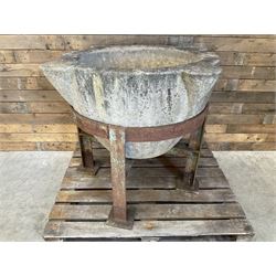 Large 19th century circular stone mortar planter on wrought iron stand