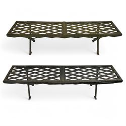 Two cast iron garden benches, rectangular seat with lozenge grate panels, on X-framed supports 