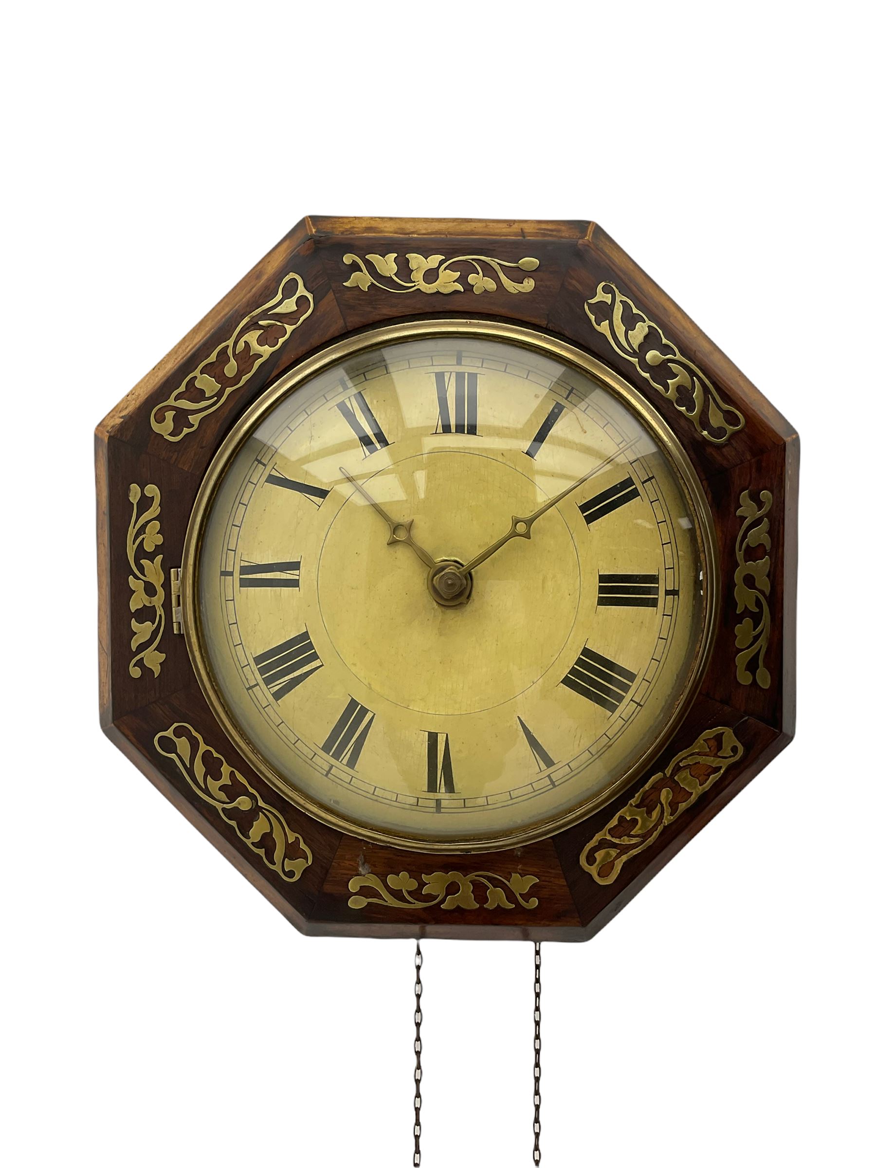 A German 19th century  “Postman’s” weight driven wall clock striking the hours on a gong, with a brass inlaid 14” hexagonal wooden bezel and a 9” painted dial with Roman numerals, minute track and cast brass hands within a spun bezel fitted with a convex glass.  With pendulum no weights .