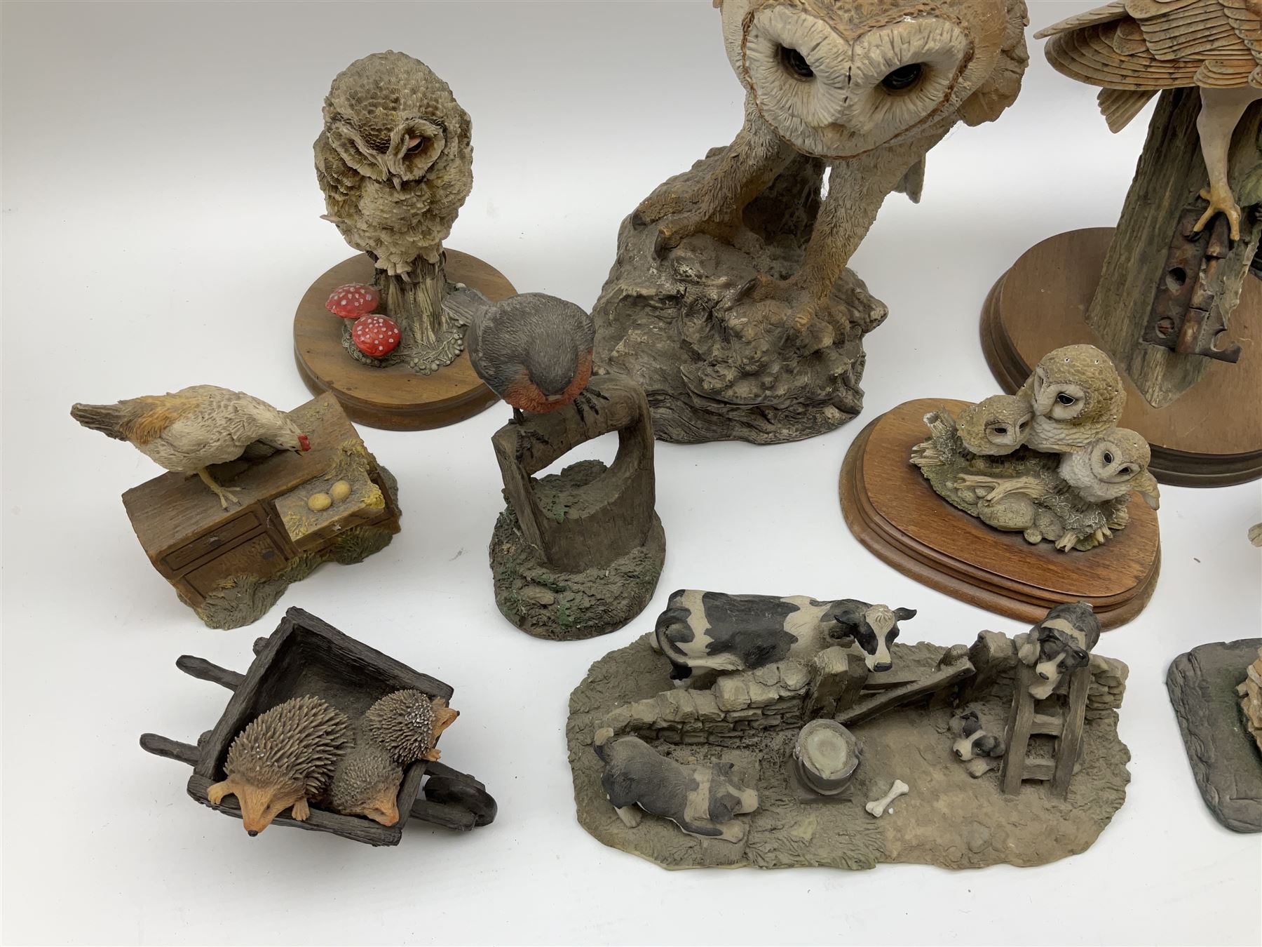 Leonardo Collection figures to include Spaniel, Border Collie, 'Nature Studies' and 'Farmyard Friends', a collection of figures including three owls a robin and a selection of farmyard scenes  