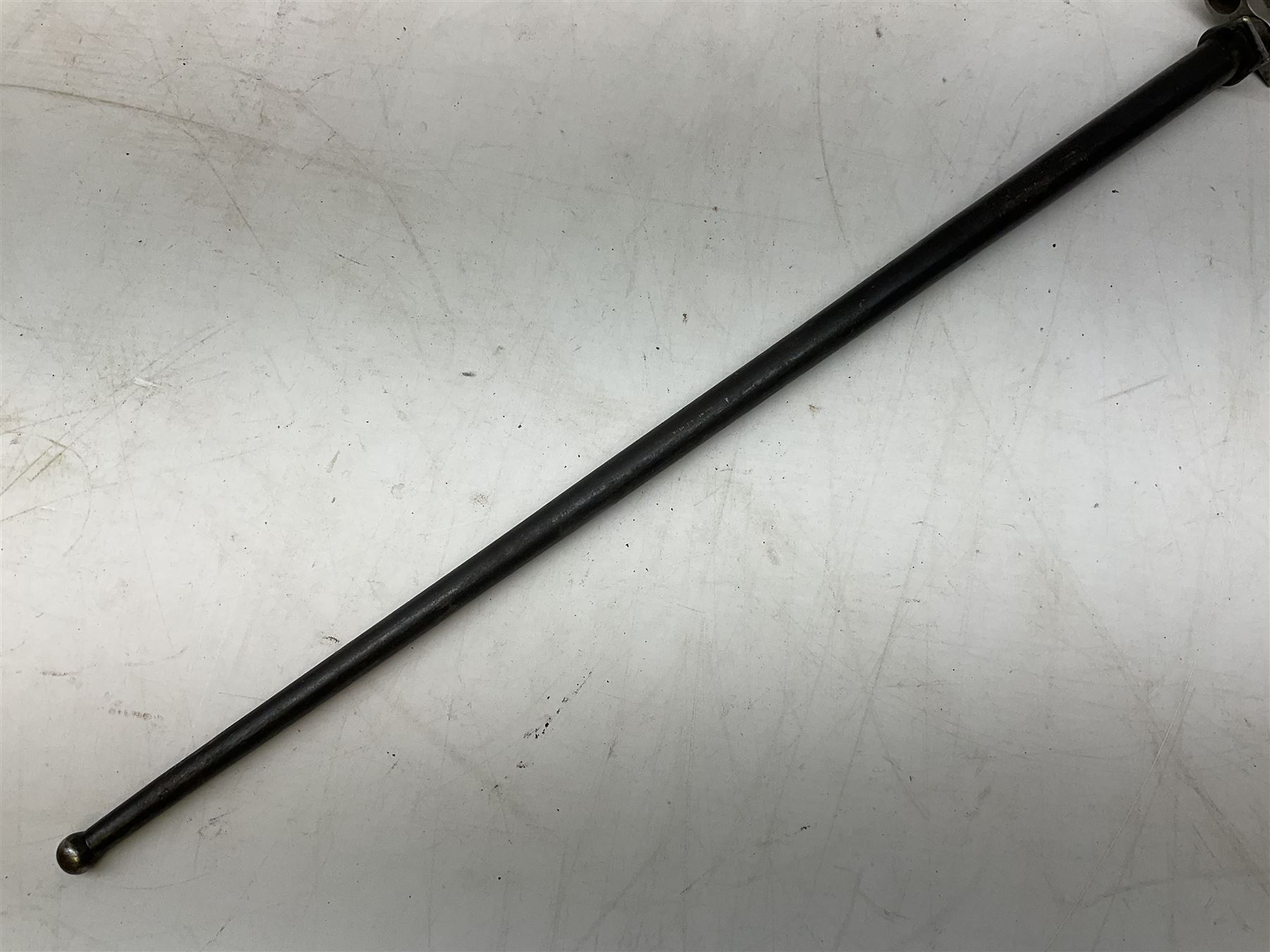 French Lebel Model 1886/93/16 bayonet with 52cm steel cruciform blade and brass hilt No.R22136; in steel tapering round scabbard numbered A62918 L65.5cm overall