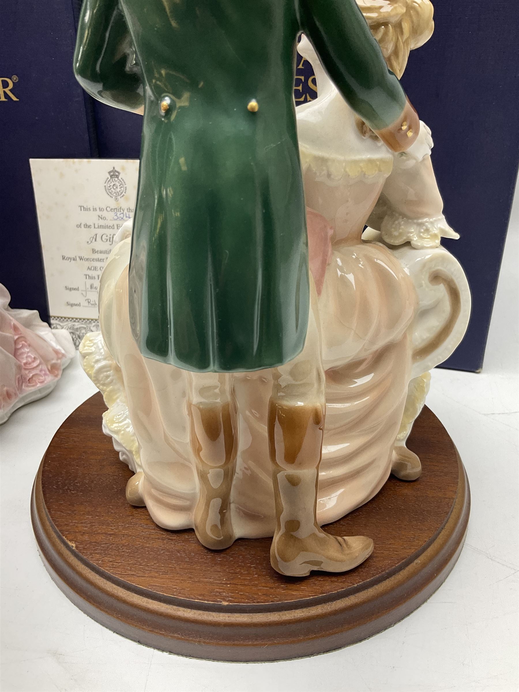 Two Royal Worcester figures, comprising A Gift of Love from the Age of Romance Series, limited edition 325/500, with certificate and original box and Royal Premier from the Glittering Occasions series, with original box 