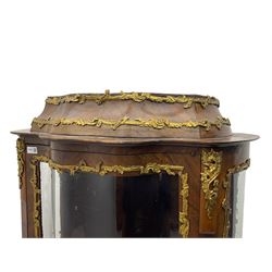Early 20th century French kingwood vitrine or display cabinet, decorated with applied foliate cast band, serpentine glazed door and sides, inlaid with marquetry decoration of floral bouquets and branches, cartouche mounts to the apron, raised on cabriole supports