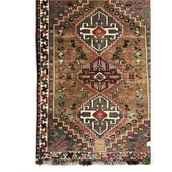 Small Iranian green and brown ground rug