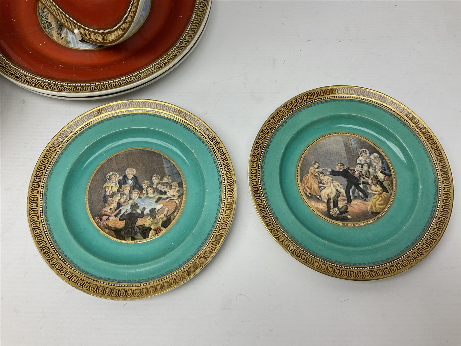 19th century Prattware table ware to include an oval footed dish decorated with a scene after Landseer 'Highland Music', retailed by James Muggleton L27.5cm, ‘The Truant’ plate after T. Webster, 'Blind Man's Buff' & 'Snap Dragon' tea plate, two side plates with malachite printed borders and others (17)