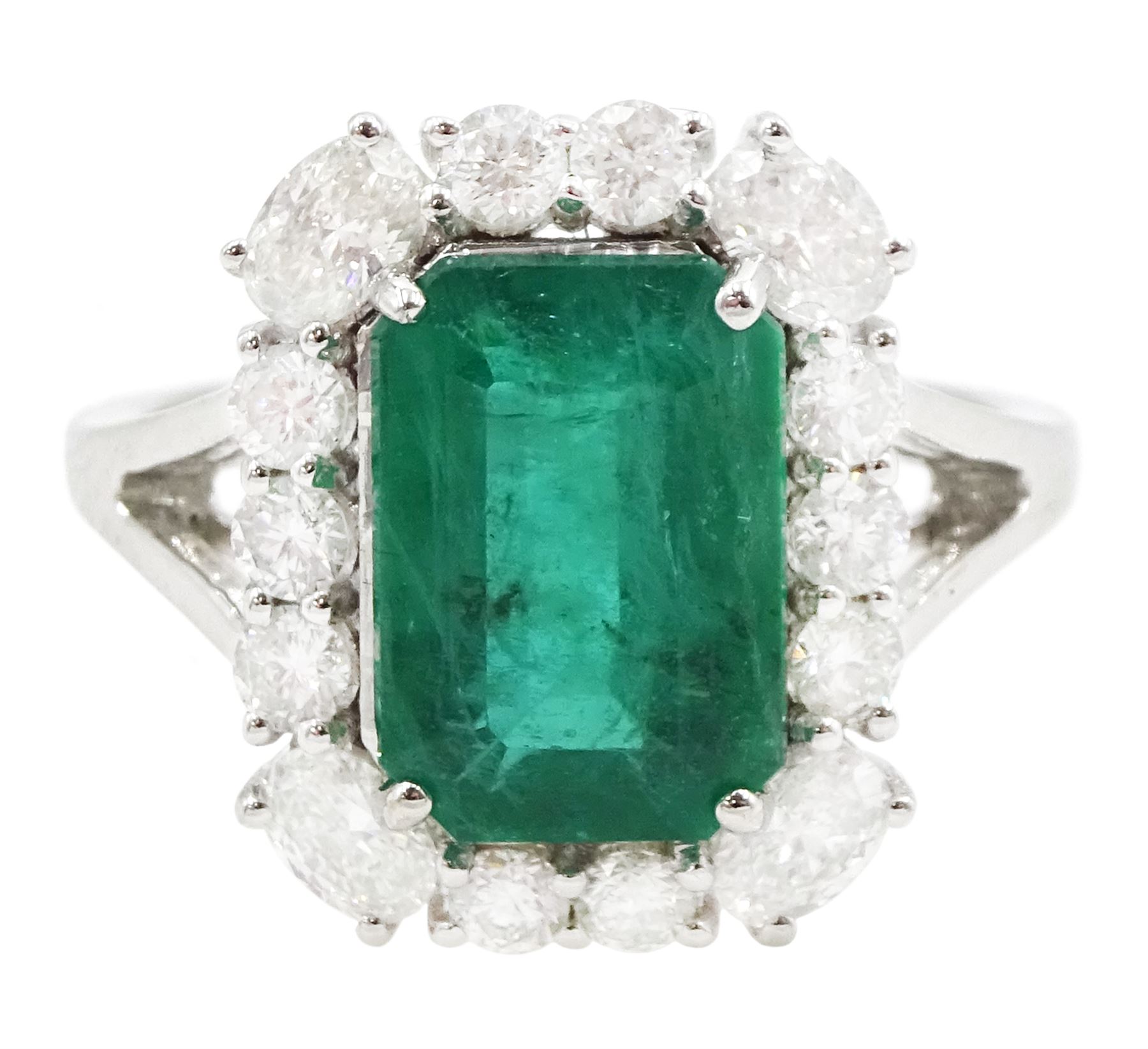 18ct white gold emerald and diamond cluster ring, single octagonal cut emerald of approx 2.90 carat, with oval cut diamonds set at each corner and round brilliant cut diamond surround, stamped, total diamond weight approx 0.90 carat