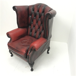 Georgian style wing back leather armchair, upholstered in deep buttoned ox blood leather, W85cm