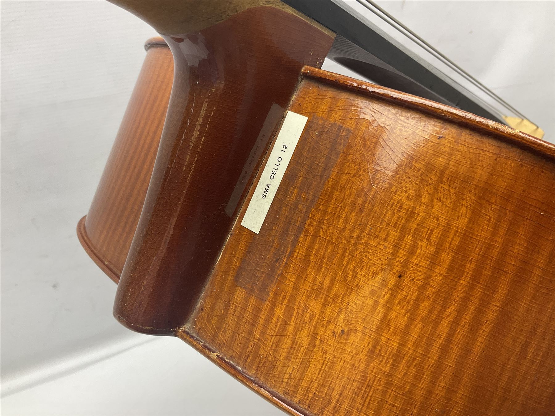 German half-size cello with 69cm two-piece maple back and ribs and spruce top; L112.5cm overall; in soft carrying case with two bows