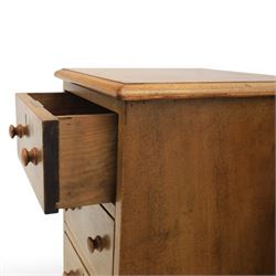 Traditional walnut inlaid pair of tall bedside chests, figured top with inlaid banding, four graduating drawers with wooden turned knobs, raised on a plinth  