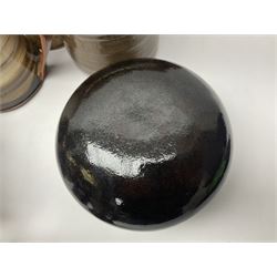 Wold studio pottery tankards, in various colours and relief decoration together with other studio items including vases, jugs and pots 