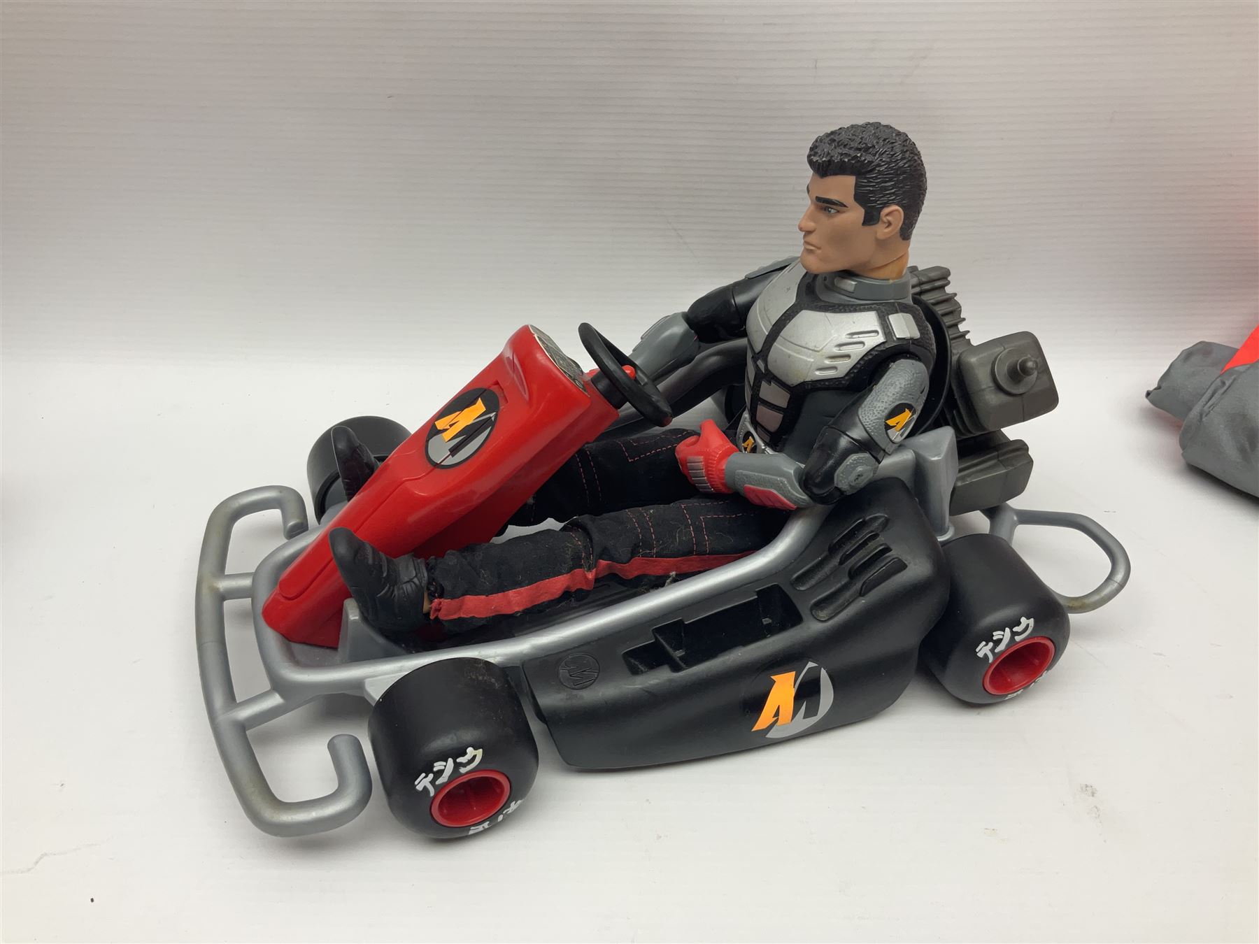 Action Man - six modern figures with associated vehicles/accessories comprising Mission Grand Prix car, motorbike with sidecar, go-kart, motorbike, snowboard and bicycle 