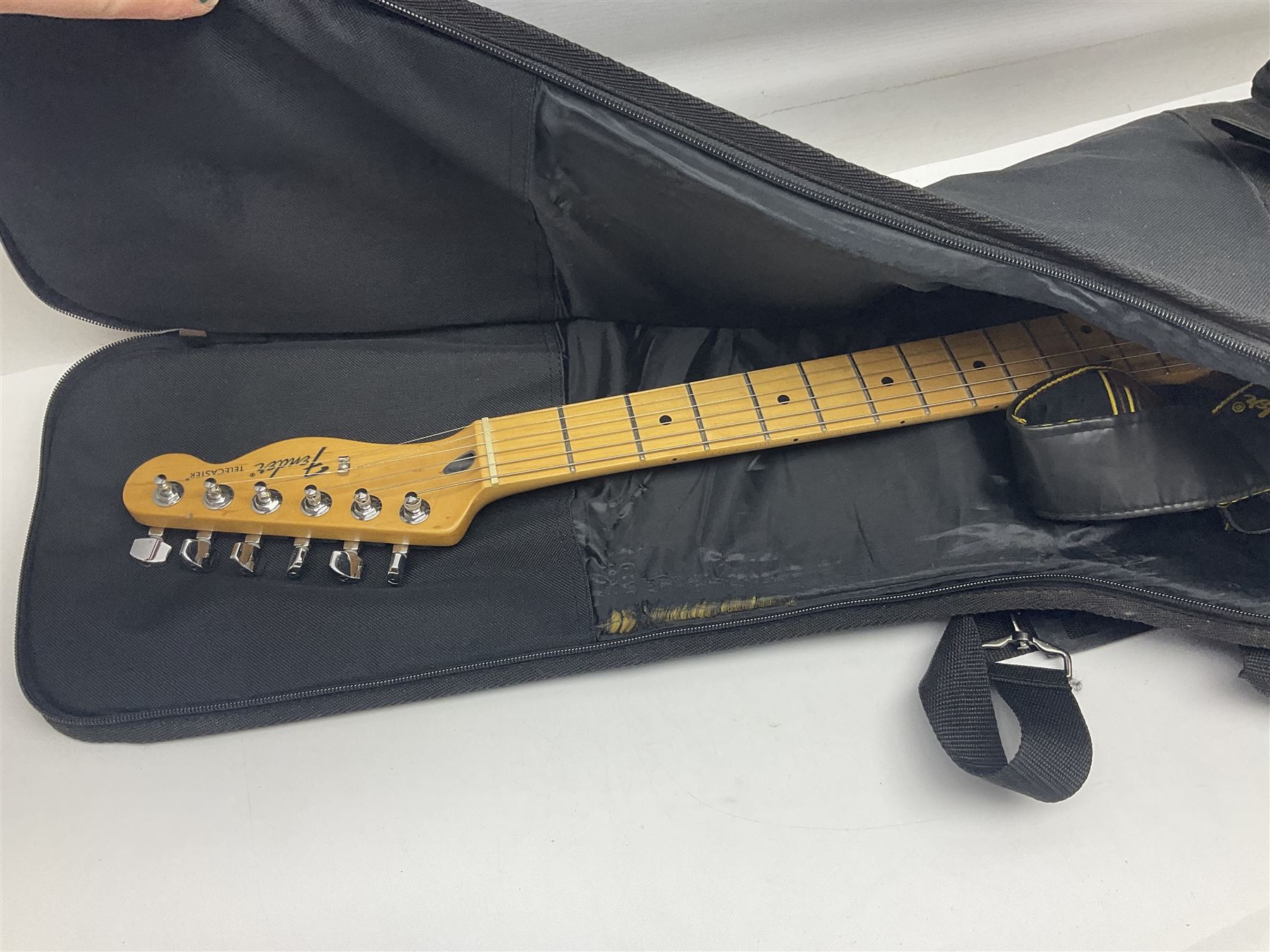 2009 Fender Telecaster electric guitar in black, retro fitted with Charlie Christian copy pick-up, serial no.MZ9546274; L98cm; in Fender soft carrying case