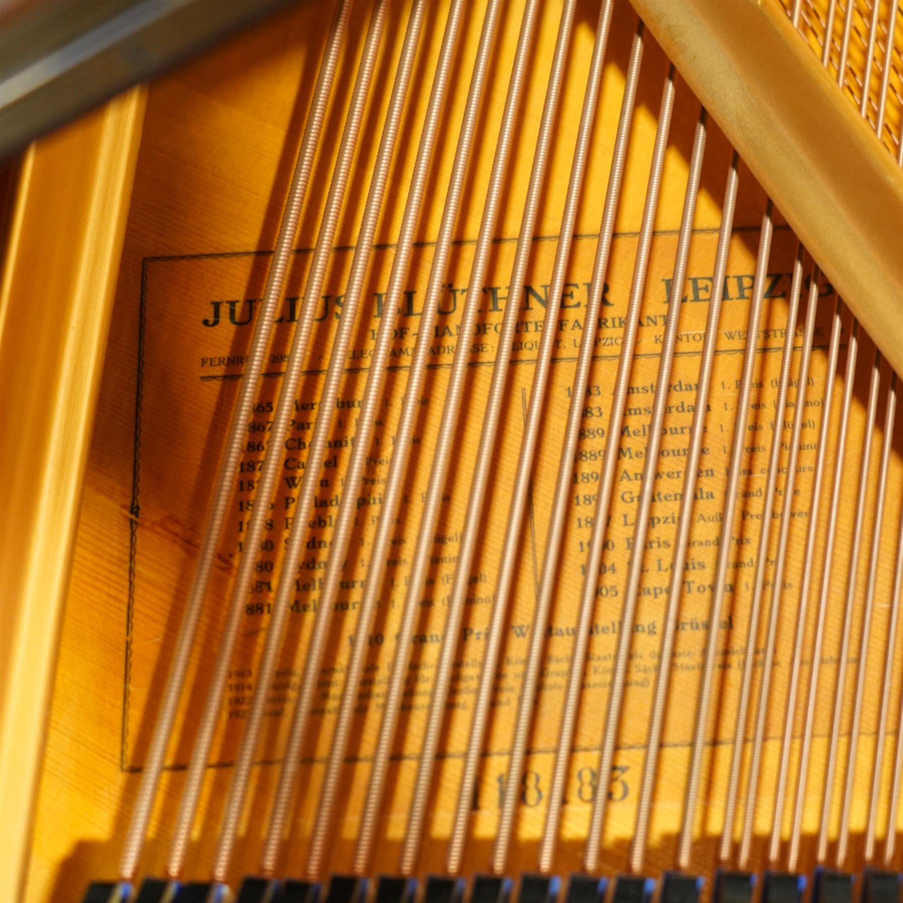 Julius Bluthner-light mahogany overstrung Baby Grand Piano serial No 118183 (1934), with a grand roller action, 88 ivory and ebony keys AO-C7, raised on three square tapered legs with brass castors, adjustable music desk and Lyre with sustain and una-corda pedals, recently (2007) thoroughly restored, case re-finished and polished, action completely overhauled and adjusted with good repetition, frame totally re-strung including copper wound bass strings, new tuning pins, hammer heads, dampers and traditional blue Bluthner string felt, in very good playing condition. With a matching adjustable piano stool fitted with a leather cover. Tuned to concert pitch, A=440.  Complete with key fall lock and key and three castor cups.
This item has been registered for sale under section 10 of the APHA Ivory Act, Reference X76CPCS8