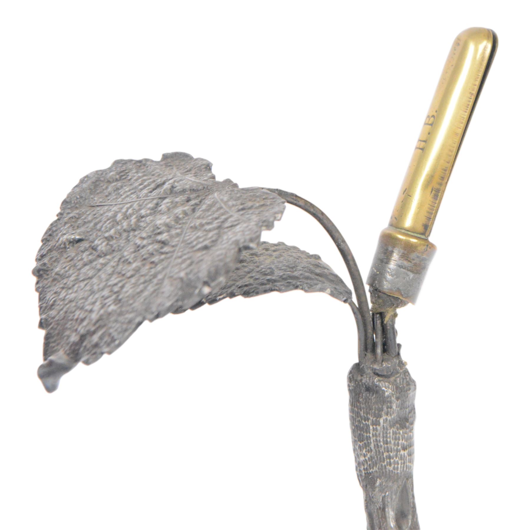 19th century silver plated desk holder, the circular naturalistically modelled base cast with fruiting vines and with applied figure of a ram, rising to a vine with two leaves, and initialled brass clip, H18cm