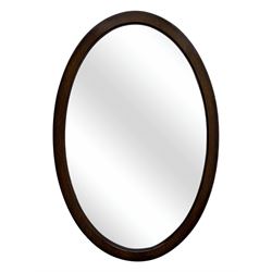 Late 19th century black-painted cane seat chair; early 20th century radial spindle-back chair with green upholstery; early 20th century mahogany single-drawer side table; mid-20th century carved wooden stool with harp motif; early 20th century hexagonal bamboo stand; two oval mirrors (7)