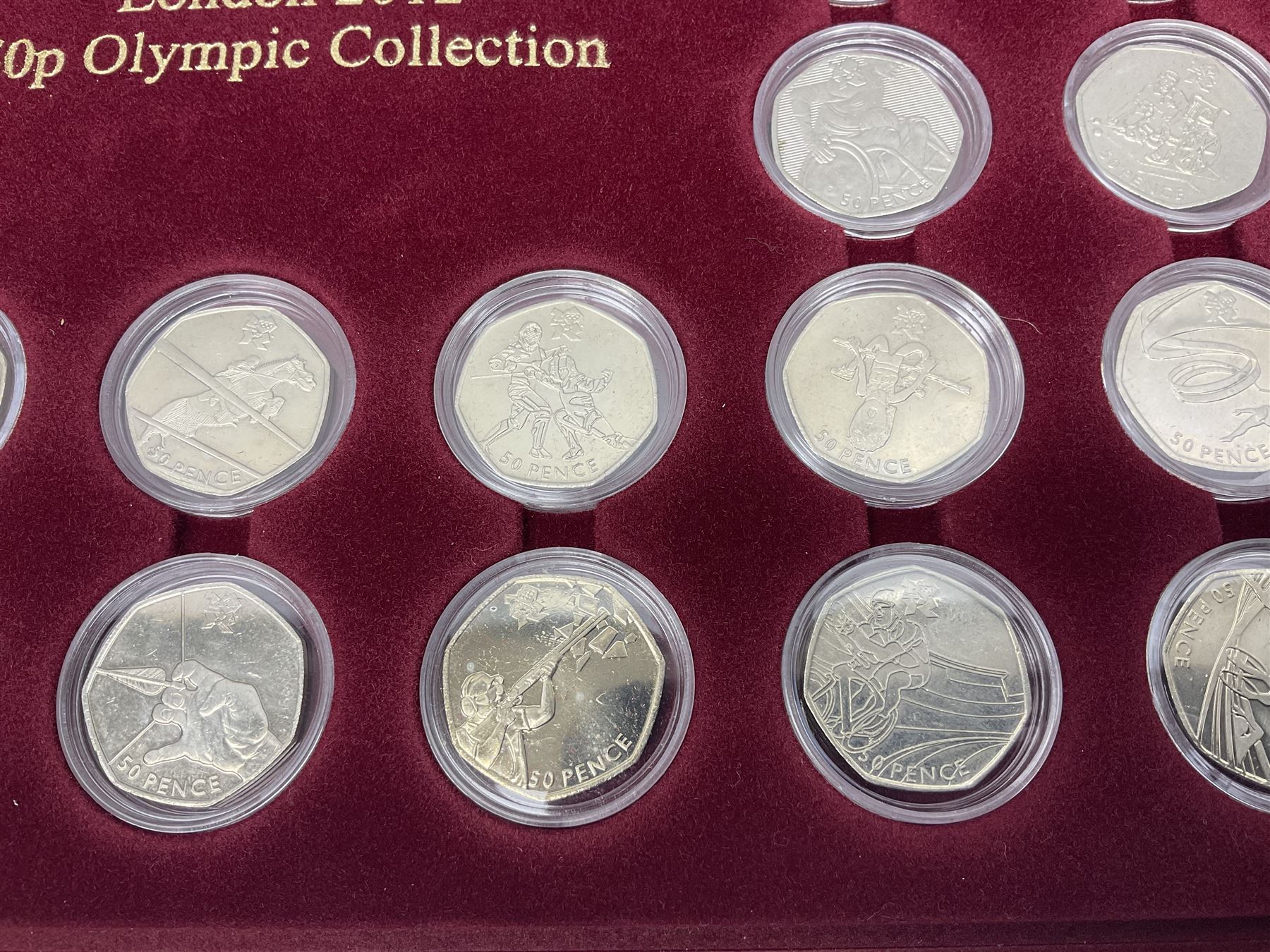 Queen Elizabeth II United Kingdom London 2012 Olympic commemorative fifty pence collection comprising twenty-nine coins, housed in unofficial display case