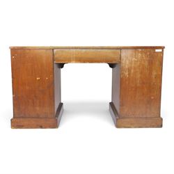 Victorian mahogany inverse breakfront twin pedestal desk, inset leather top over central drawer, flanked by pedestals with four graduating drawers, raised on a plinth base